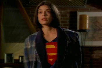 Lois Lane wearing Superman pajamas and a robe